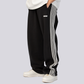 ATHLEISURE STRIPED TRACK PANTS – Black